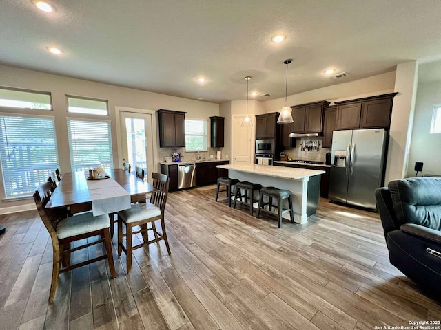 251 Burning Star Blvd, Castroville, TX 78009 - dining space with light wood finished floors and recessed lighting