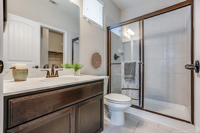 2714 Trailmont Dr, San Antonio, TX 78253 - full bathroom with vanity, a shower stall, tile patterned floors, and toilet