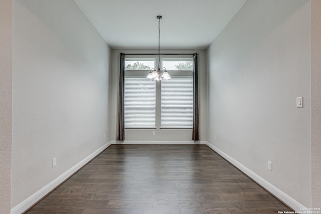 2714 Trailmont Dr, San Antonio, TX 78253 - unfurnished dining area with a chandelier, dark wood-style floors, and baseboards