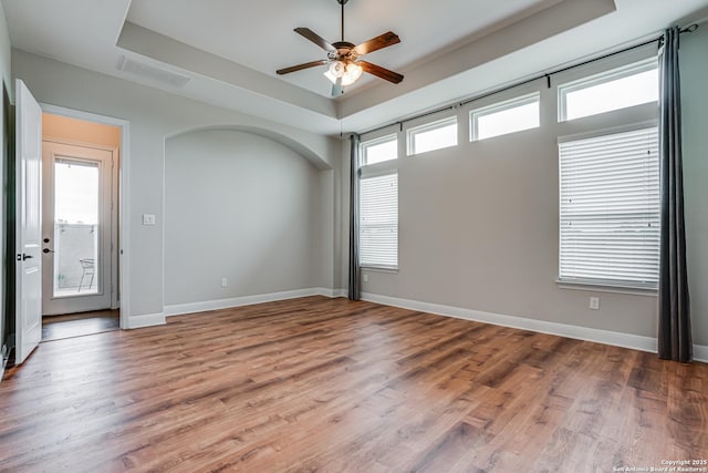 2714 Trailmont Dr, San Antonio, TX 78253 - spare room with a tray ceiling, a ceiling fan, wood finished floors, and baseboards