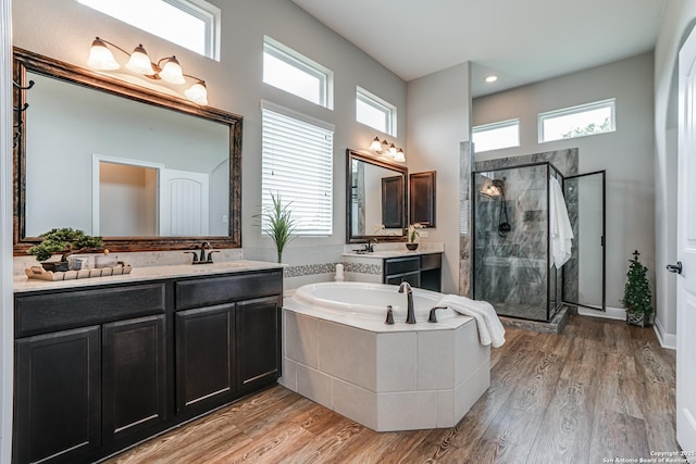 2714 Trailmont Dr, San Antonio, TX 78253 - full bath with a stall shower, a bath, vanity, wood finished floors, and a high ceiling
