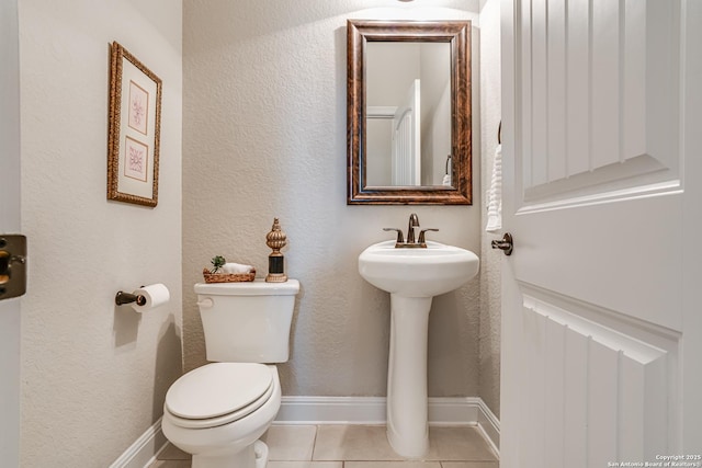 2714 Trailmont Dr, San Antonio, TX 78253 - bathroom featuring toilet, tile patterned flooring, a textured wall, and a sink