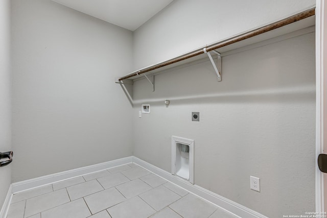 2714 Trailmont Dr, San Antonio, TX 78253 - laundry room featuring electric dryer hookup, hookup for a gas dryer, washer hookup, light tile patterned flooring, and baseboards