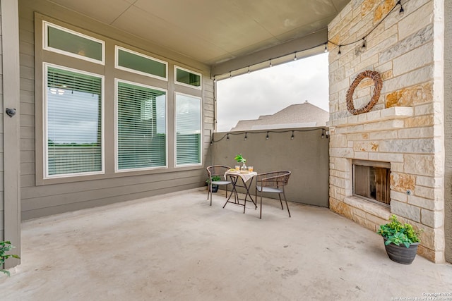 2714 Trailmont Dr, San Antonio, TX 78253 - view of patio with outdoor dining area and an outdoor stone fireplace