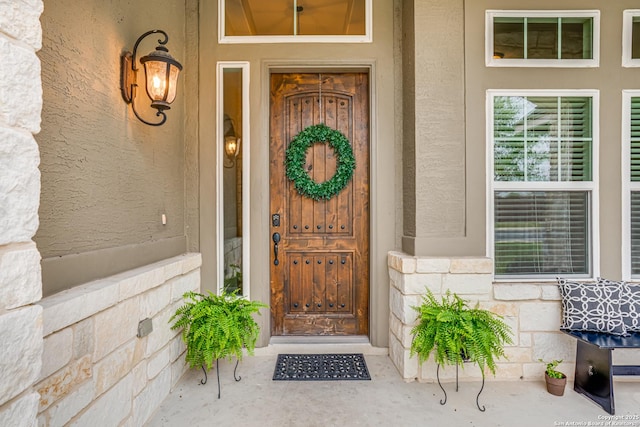 2714 Trailmont Dr, San Antonio, TX 78253 - entrance to property with stone siding, covered porch, and stucco siding
