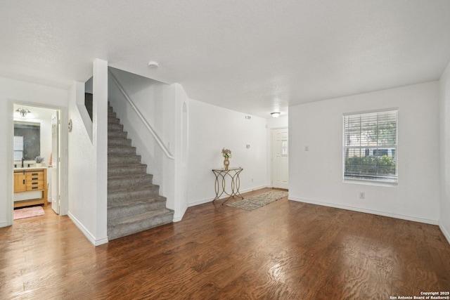 5815 Trent, San Antonio, TX 78249 - unfurnished living room with wood finished floors, stairs, and baseboards