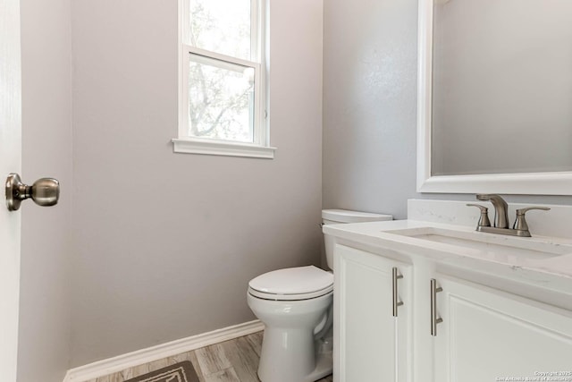 20827 Foothill Pne, San Antonio, TX 78259 - bathroom with toilet, vanity, baseboards, and wood finished floors