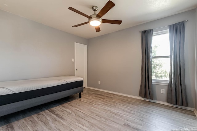 20827 Foothill Pne, San Antonio, TX 78259 - bedroom featuring light wood-style flooring, multiple windows, and baseboards