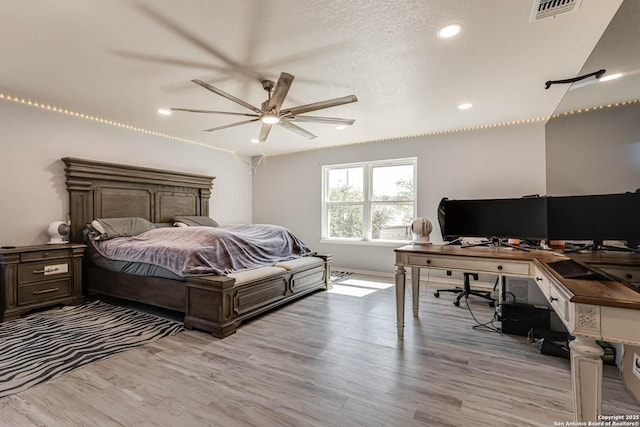 20827 Foothill Pne, San Antonio, TX 78259 - bedroom with light wood finished floors, recessed lighting, and a desk