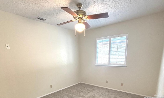 8526 Timberwilde, San Antonio, TX 78250 - carpeted empty room with ceiling fan, baseboards, and a textured ceiling