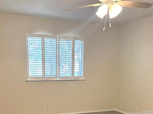 8526 Timberwilde, San Antonio, TX 78250 - unfurnished room featuring ceiling fan, plenty of natural light, baseboards, carpet flooring, and a textured ceiling
