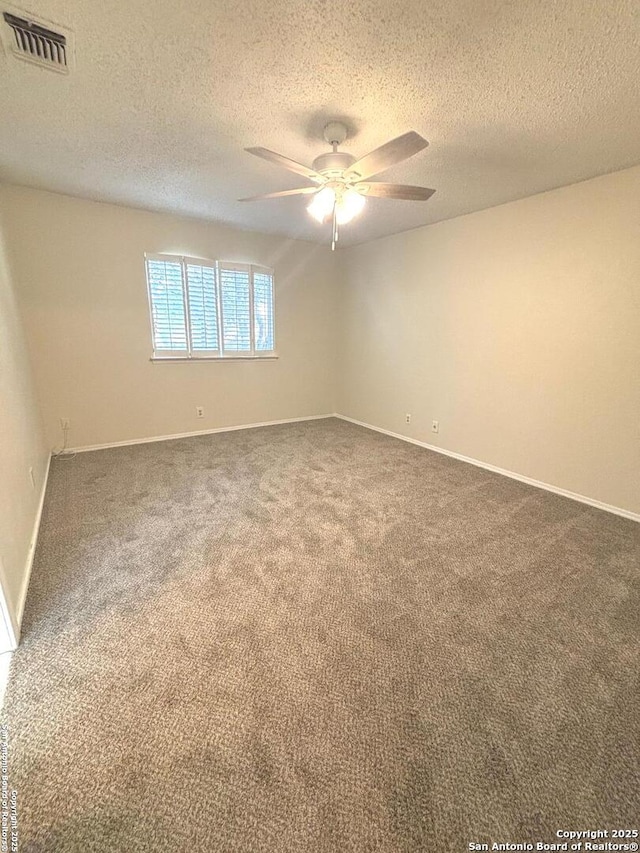 8526 Timberwilde, San Antonio, TX 78250 - carpeted spare room with ceiling fan, a textured ceiling, and baseboards