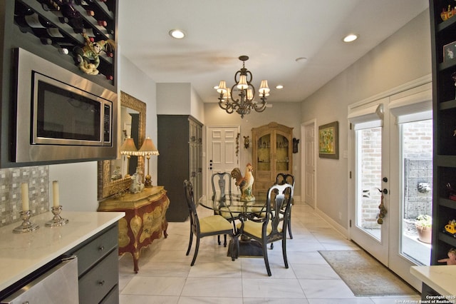 8 Kensington Ct, San Antonio, TX 78218 - dining area with healthy amount of natural light, french doors, a chandelier, recessed lighting, and light tile patterned floors