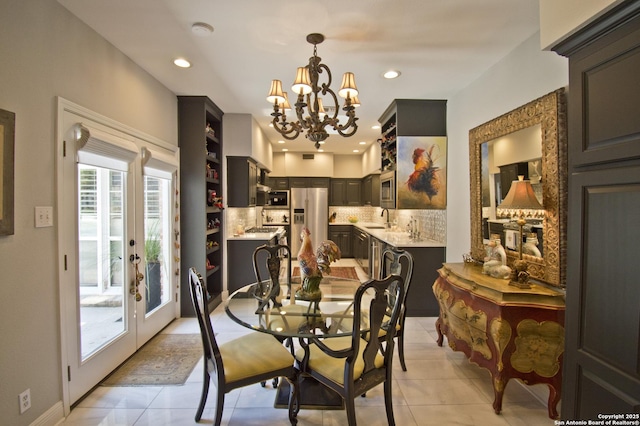 8 Kensington Ct, San Antonio, TX 78218 - dining space featuring a chandelier, recessed lighting, and light tile patterned floors