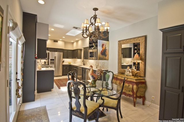 8 Kensington Ct, San Antonio, TX 78218 - dining room with a chandelier, light tile patterned flooring, and recessed lighting