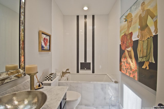 8 Kensington Ct, San Antonio, TX 78218 - bathroom with tiled tub, toilet, and vanity