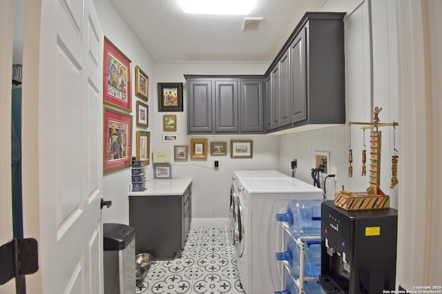 8 Kensington Ct, San Antonio, TX 78218 - laundry area with cabinet space, washing machine and dryer, light tile patterned flooring, and baseboards