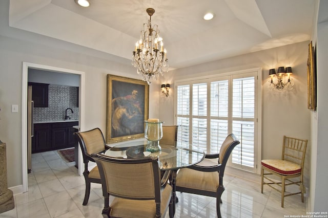 8 Kensington Ct, San Antonio, TX 78218 - dining space with a chandelier, a tray ceiling, and recessed lighting