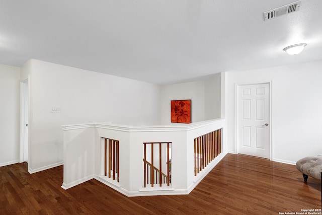 4451 Taylors Bnd, San Antonio, TX 78247 - corridor featuring an upstairs landing and wood finished floors