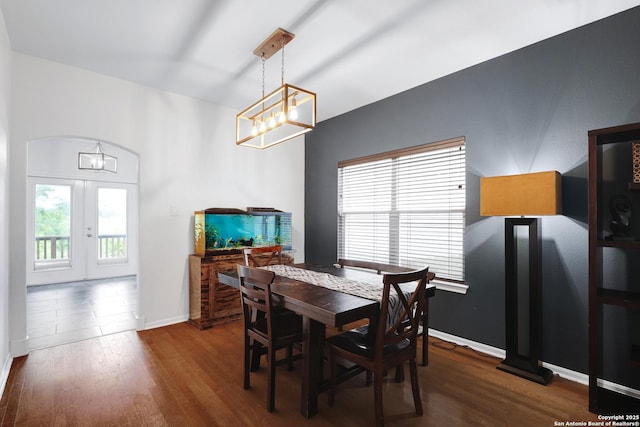 4451 Taylors Bnd, San Antonio, TX 78247 - dining area with dark wood-style floors, french doors, and a chandelier