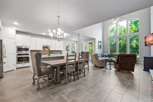 9706 Kremmen, Boerne, TX 78006 - dining area with healthy amount of natural light, a chandelier, recessed lighting, and ceiling fan