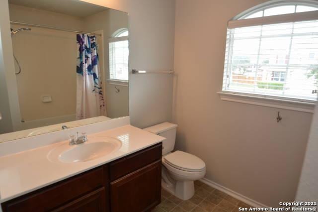 807 Maltese Gdn, San Antonio, TX 78260 - bathroom featuring healthy amount of natural light, vanity, toilet, and curtained shower
