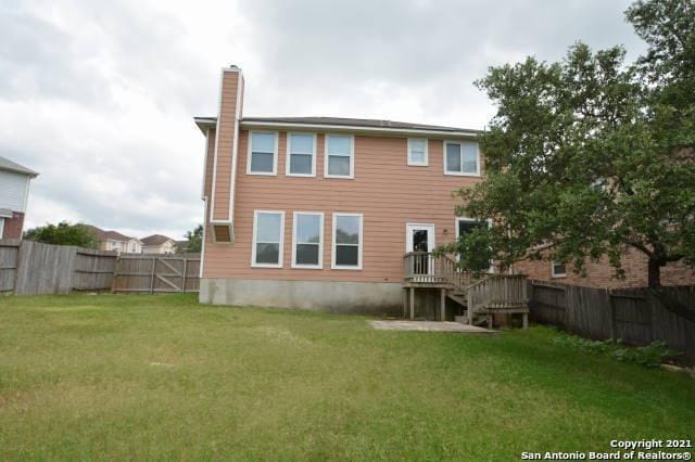 807 Maltese Gdn, San Antonio, TX 78260 - rear view of property with a chimney