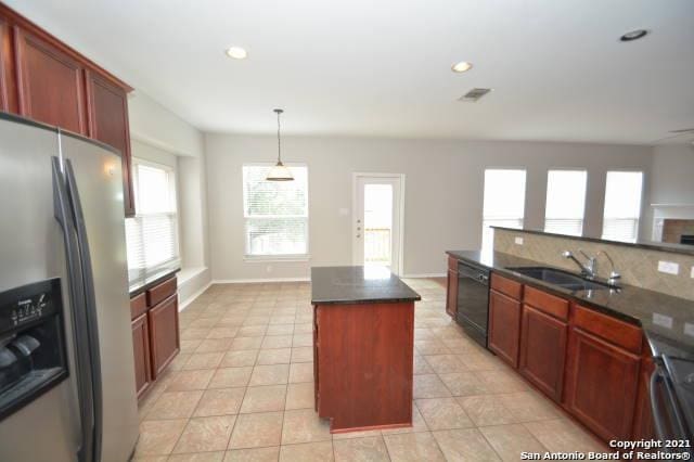 807 Maltese Gdn, San Antonio, TX 78260 - kitchen with stainless steel refrigerator with ice dispenser, dishwasher, a sink, a center island, and light tile patterned floors