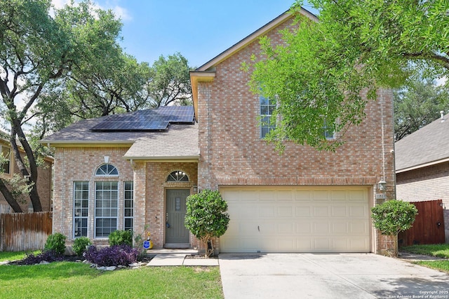 11823 Stanton, San Antonio, TX 78253 - traditional-style home featuring brick siding, solar panels, concrete driveway, an attached garage, and roof with shingles