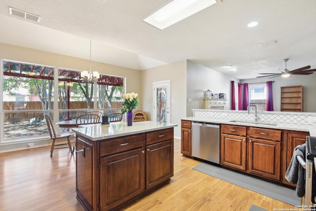 11823 Stanton, San Antonio, TX 78253 - kitchen with dishwasher, a sink, light wood-style flooring, a chandelier, and recessed lighting