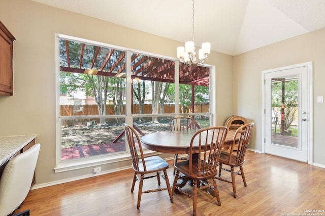 11823 Stanton, San Antonio, TX 78253 - dining space with a chandelier, light wood-style floors, vaulted ceiling, and baseboards