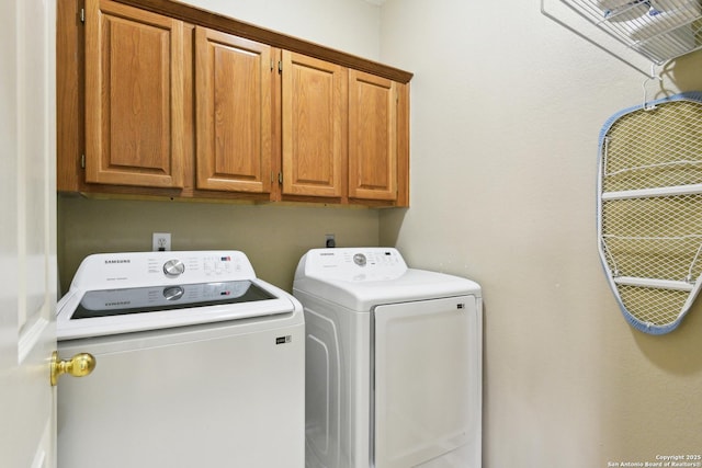 11823 Stanton, San Antonio, TX 78253 - laundry room with cabinet space and washer and clothes dryer