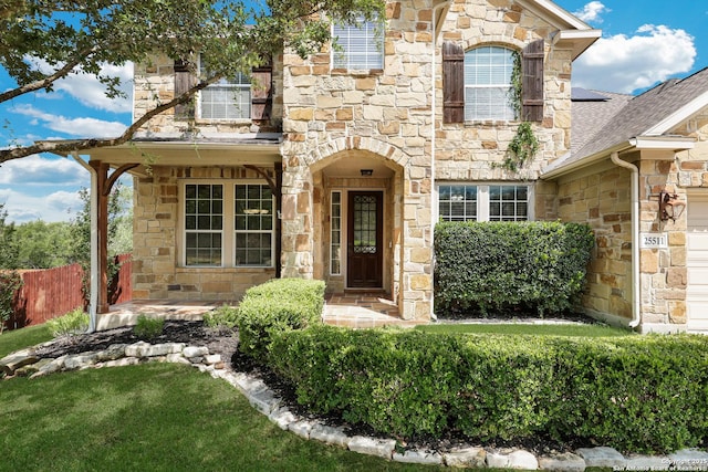 25511 Willard Path, San Antonio, TX 78261 - view of front of property featuring stone siding, a garage, and roof with shingles