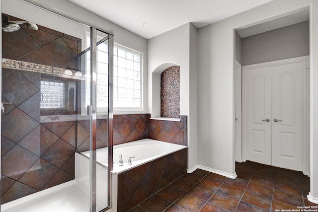 25511 Willard Path, San Antonio, TX 78261 - full bath with a bath, a shower stall, and baseboards