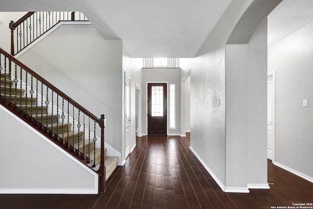 25511 Willard Path, San Antonio, TX 78261 - foyer featuring a textured wall, wood finished floors, stairway, and baseboards