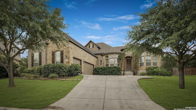 26358 Tawny Way, Boerne, TX 78015 - french provincial home featuring a garage, stone siding, and concrete driveway
