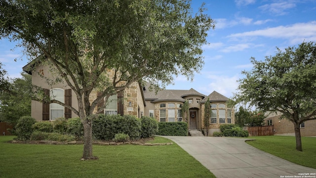26358 Tawny Way, Boerne, TX 78015 - french provincial home featuring stone siding, stucco siding, and concrete driveway