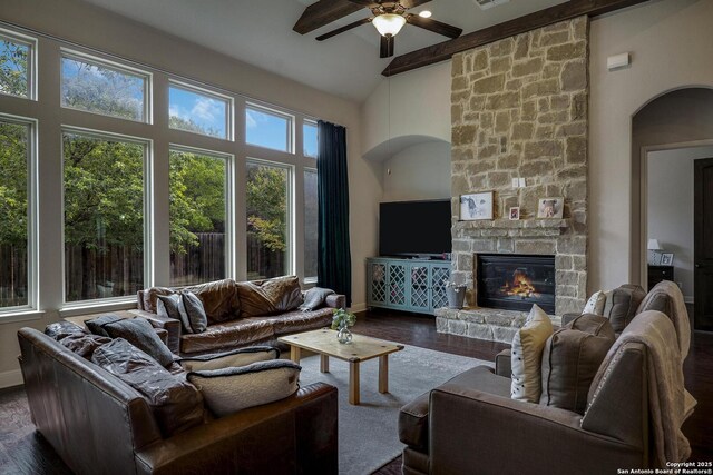 26358 Tawny Way, Boerne, TX 78015 - living area featuring a ceiling fan, high vaulted ceiling, a fireplace, wood finished floors, and arched walkways