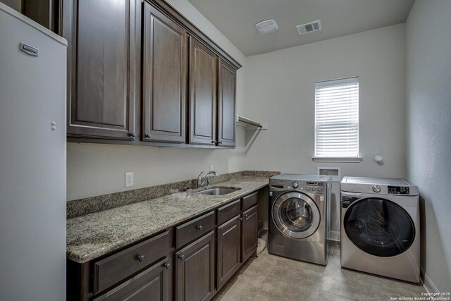 26358 Tawny Way, Boerne, TX 78015 - laundry room featuring independent washer and dryer and cabinet space