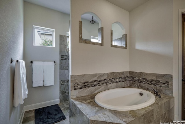 26358 Tawny Way, Boerne, TX 78015 - bathroom featuring a bath, baseboards, and a walk in shower
