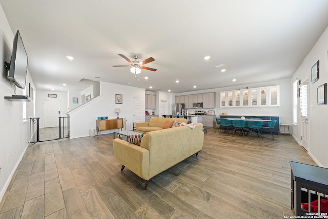 10815 Fox Trot, Converse, TX 78109 - living room with wood finished floors, recessed lighting, ceiling fan, and baseboards