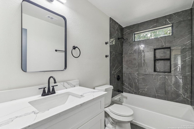 228 Quinta St, San Antonio, TX 78210 - full bath featuring toilet, shower / bathtub combination, vanity, and a textured wall