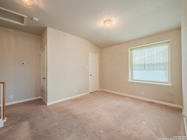 775 Guna Dr, New Braunfels, TX 78130 - carpeted empty room featuring a smoke detector, baseboards, vaulted ceiling, and attic access