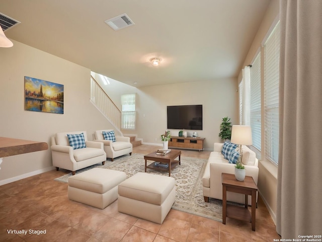 775 Guna Dr, New Braunfels, TX 78130 - living area featuring stairs, baseboards, and light tile patterned floors