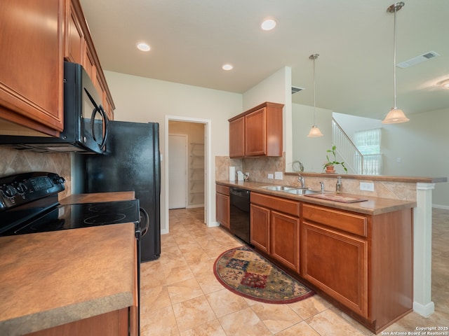 775 Guna Dr, New Braunfels, TX 78130 - kitchen with black appliances, backsplash, a peninsula, brown cabinets, and decorative light fixtures