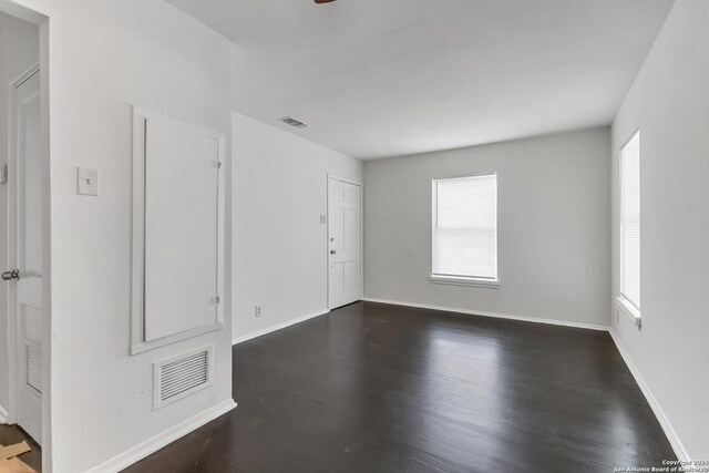 143 Langford, San Antonio, TX 78221 - empty room with plenty of natural light, dark wood-style floors, and baseboards