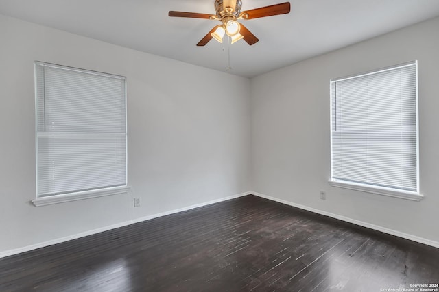 143 Langford, San Antonio, TX 78221 - spare room with dark wood-style floors, baseboards, and ceiling fan