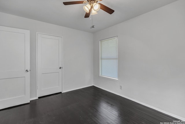 143 Langford, San Antonio, TX 78221 - spare room featuring ceiling fan, baseboards, and dark wood-style flooring