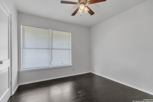 143 Langford, San Antonio, TX 78221 - spare room with a ceiling fan, baseboards, and dark wood-style floors