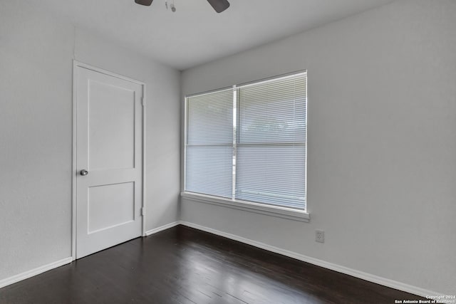 143 Langford, San Antonio, TX 78221 - spare room featuring a ceiling fan, baseboards, and dark wood finished floors